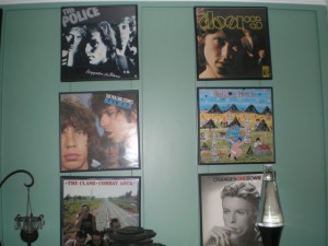 a wall of rock and roll photos, mick jagger, etc.
